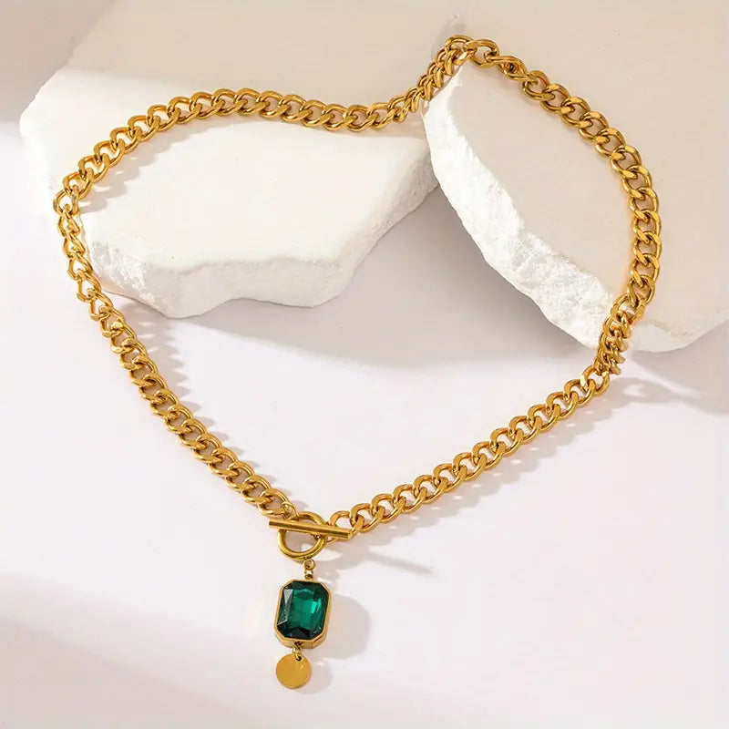 Collana a catena in oro con smeraldo
