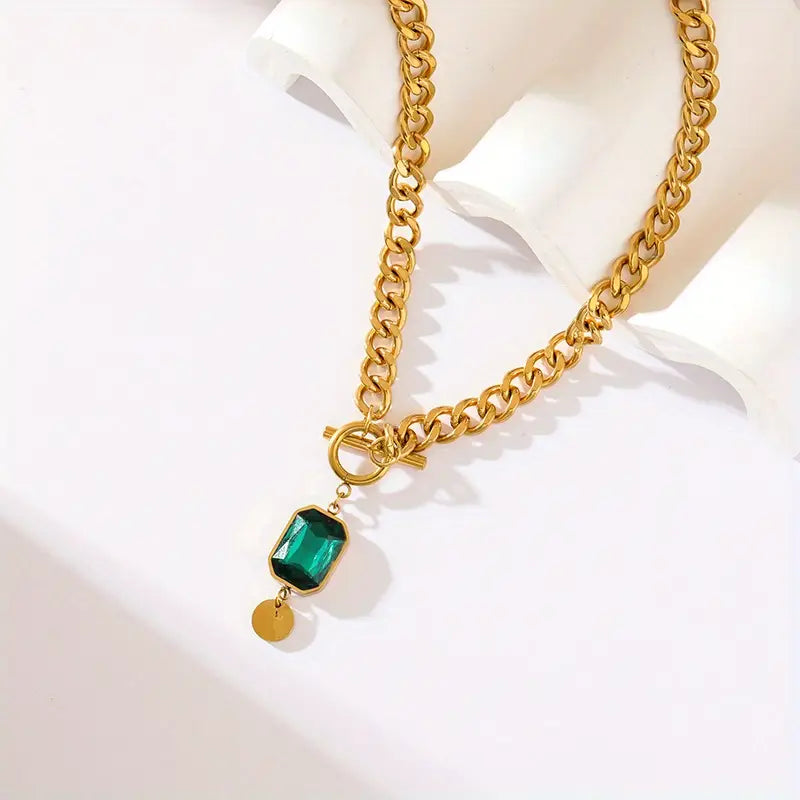 Collana a catena in oro con smeraldo
