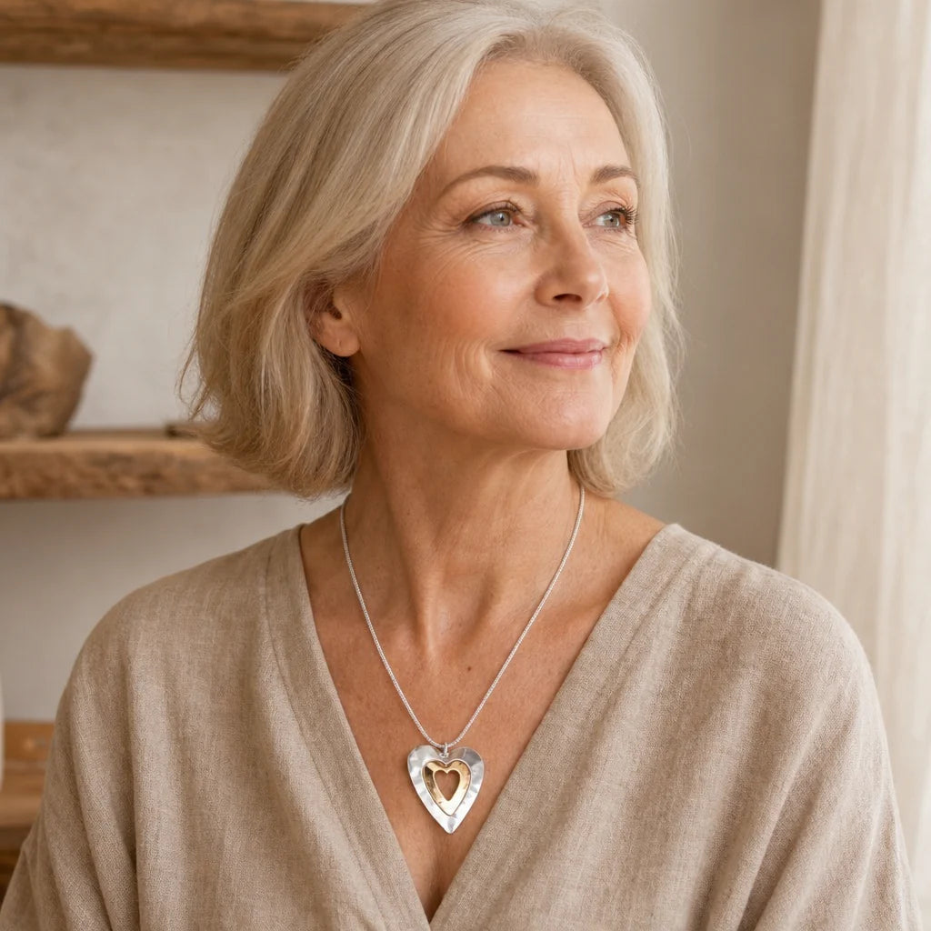 Collana vintage con ciondolo a cuore in argento e oro