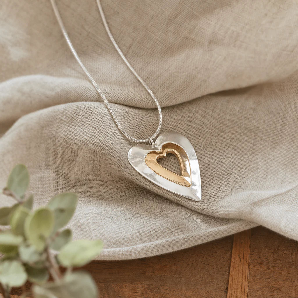 Collana vintage con ciondolo a cuore in argento e oro