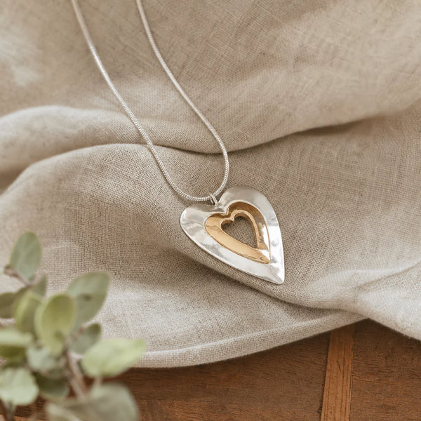Collana vintage con ciondolo a cuore in argento e oro